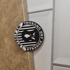 Strange and Unusual Pin - Black and White
